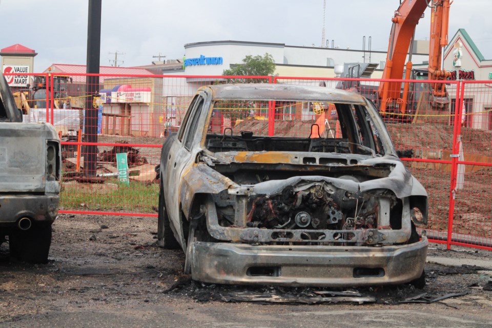 The gutted remains of a newer model Dodge pickup sits at the Oasis lot.  The fire that destroyed the truck and another vehicle is being investigated as arson. The area is part of a massive construction project that has closed down much of the street. Since the project, began, say local business owner, incidents of crime and suspicious behaviour have gone up.
