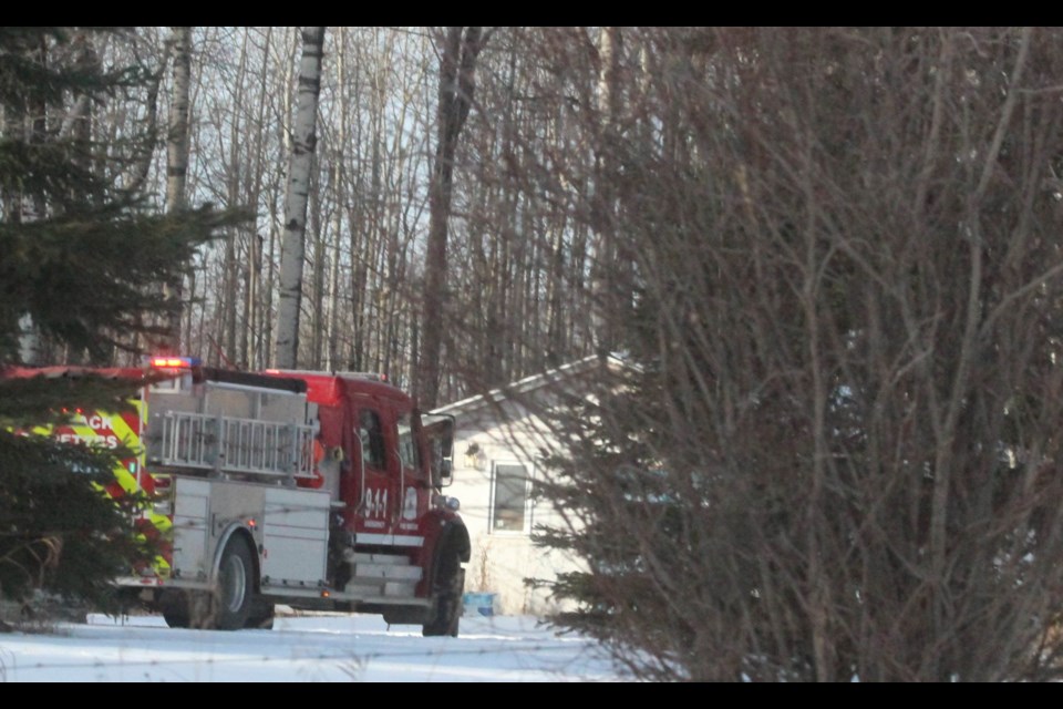 A Lac La Biche County fire truck arrives at a rural home along the Mission Road on Thursday morning after carbon monoxide alarms notified residents of a possible threat.