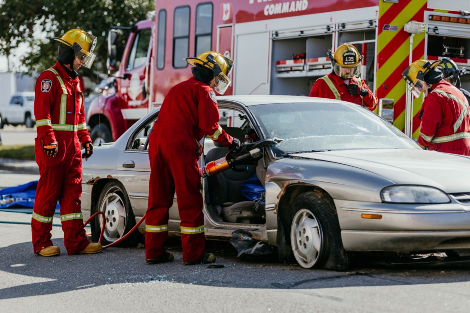 Firefighters perform demonstrations at the Saturday afternoon open house at the St. Paul Fire Hall.