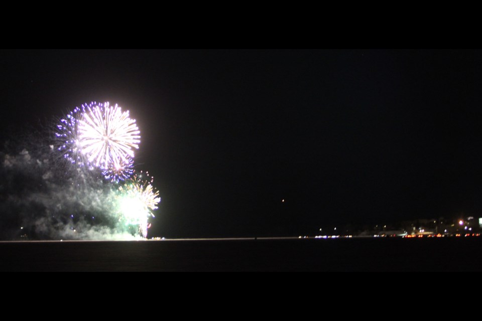 The Lac La Biche shoreline along Churchill  Drive can be seen in the distance as fireworks shine from their on-ice launch pad. The Family Day Fireworks display in Lac La Biche County drew hundreds to the unique and COVID-friendly winter spectacel.     Image Rob McKinley