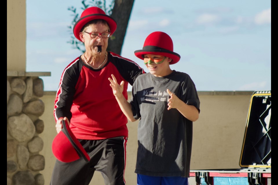 Flyin' Bob Palmer with a  young circus camper from last year's week-long event