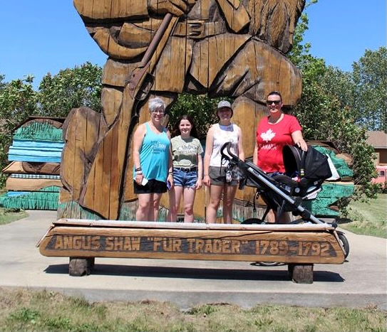 Team Summer Heat found a fur trader and took a photo with him. 

(left to right) Kim Dechaine, Skylar Dechaine, Aletta Dechaine, and Erin Murphy. Photo by Robynne Henry. 