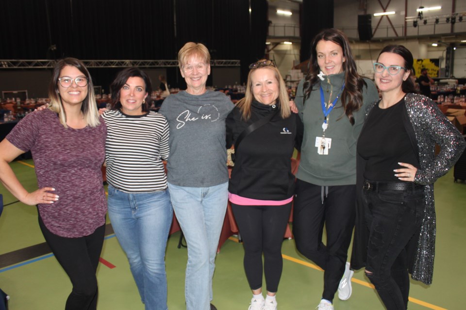 Bonnyville Health Foundation Board members pitching in Friday to ensure everything was in place for Saturday's fundraising gala are (left to right): Kirsten Lynch, board chair Amber Hughes, vice-chair Patti Skuba, Kim Foisy, Cass Kelly and executive director Dawn Weber.
