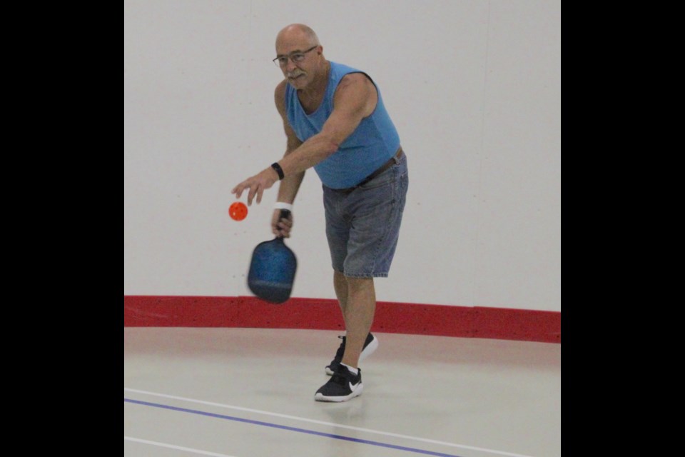 Garry Nunns with the Lac La Biche pickleball club displays an under-hand serve.  The sport is popular on indoor and outdoor courts across the region.