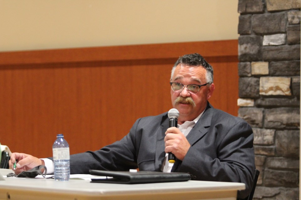 Mayoral candidate George L'Heureux answers an audience question on October 5, mayoral forum.