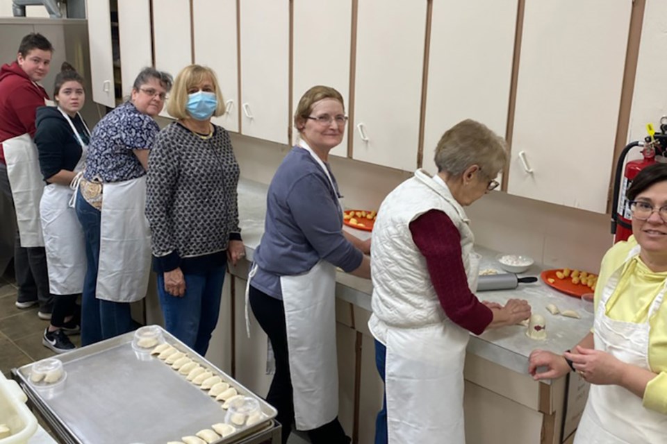 Volunteers in the Village of Glendon have been busy making perogies to raise funds for humanitarian efforts in Ukraine. The community is using its claim to fame as the perogy capital - and its deep Ukrainian roots - to do what it can to help those in need. Perogies can be purchased by contacting the Village of Glendon office. The catering club has also been helping make perogies for a school-based fundraiser at Glendon School (pictured). / Supplied photo
