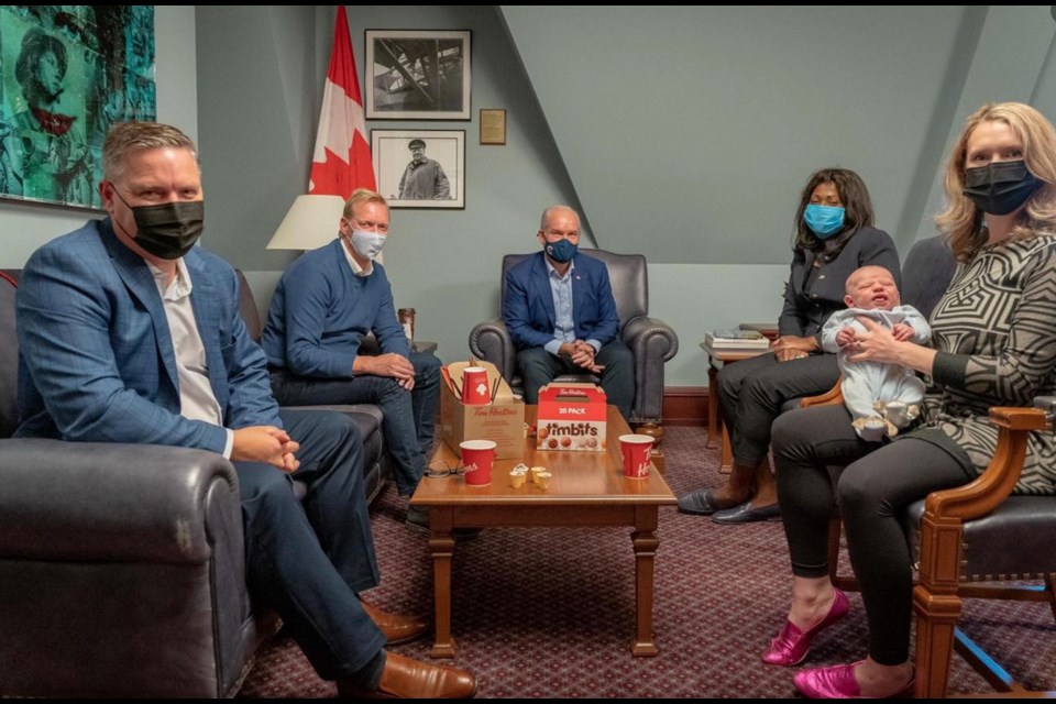 Fort McMurray-Cold Lake MP Laila Goodrige and her newborn at a meeting with federal party staff and Erin O'Toole. The image and others were posted to the MP's political social media page late last year.