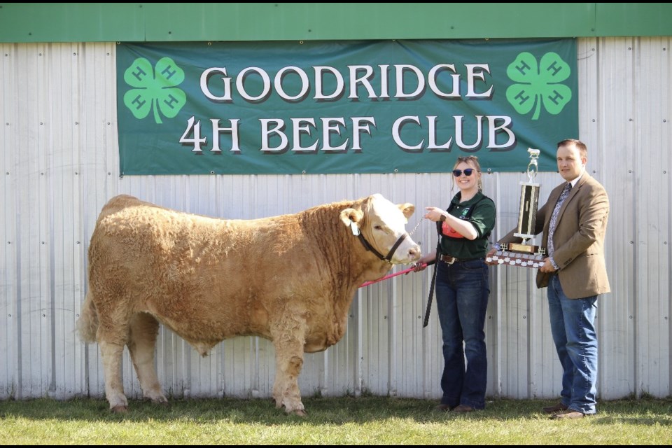 Austin Kwiatkowski is shown with her Grand Champion Steer. 