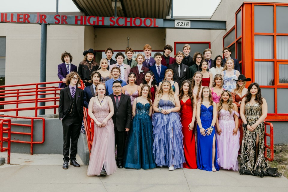 The class of 2025 pose outside FG Miller Jr./Sr. High School in Elk Point just before heading inside for the school's graduation ceremony.