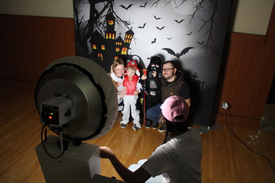 Stephanie and Jeff Halasz and their kids Harrison and Hendrix pose for a family picture during last Sunday afternoon's family Spooktacular at the Bold Center. The pre-Halloween event ensured COVID safety protocols with social distancing and restricted admissions. Deputy Mayor Colin Cote expects some of those healthy recommendations will be seen on Saturday for trick-or-treating in local neighbourhoods.    Image Rob McKinley
