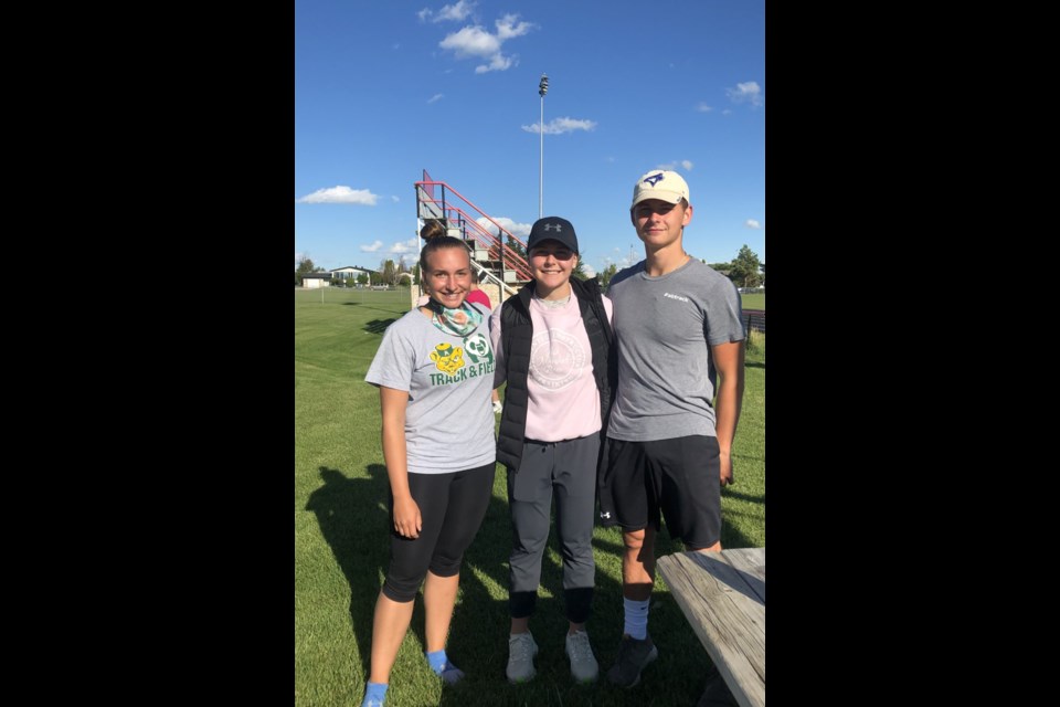Courtney, Taylor and Daniel Hebert coordinated and coached young athletes during the speed clinic in St. Paul. Photo supplied.
