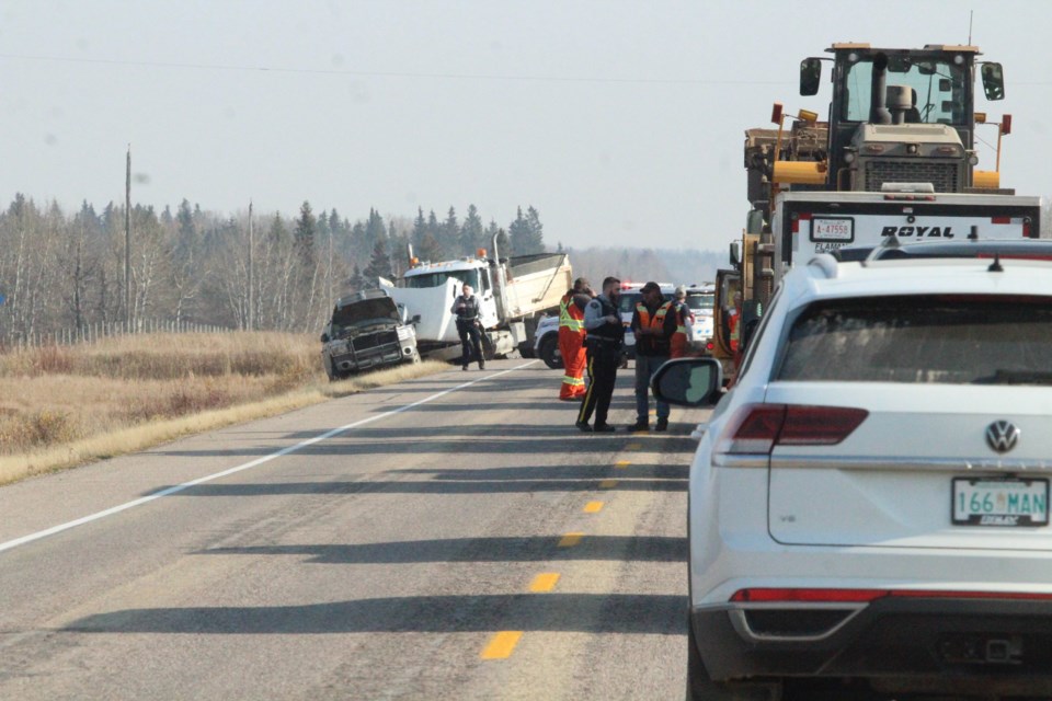 RCMP explain to east-bound drivers that an alternate route around the Highway 55 crash scene is available. The highway was closed for several hours following the crash between at least two vehicles,.
