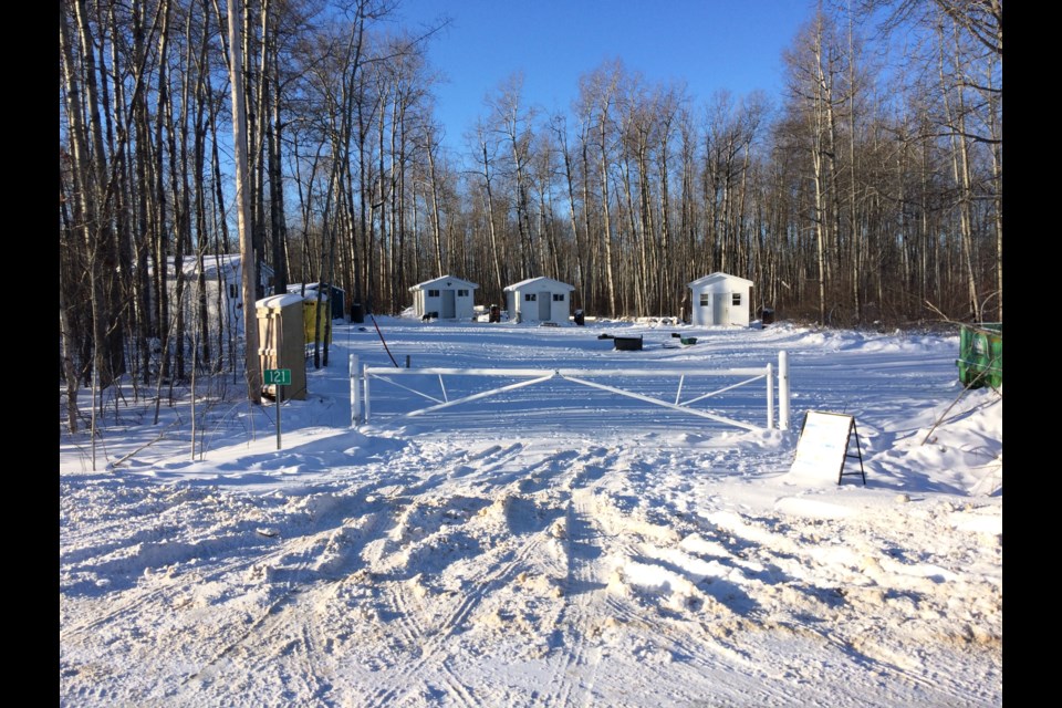 The temporary homeless camp in the Bonesville subdivision has six small sheds serviced with power. The residential acreage lot is supplied with firewood and port-a-potties. The site will remain open until the new transitional housing facility is opened near the Alexander Hamilton Park in Lac La Biche.