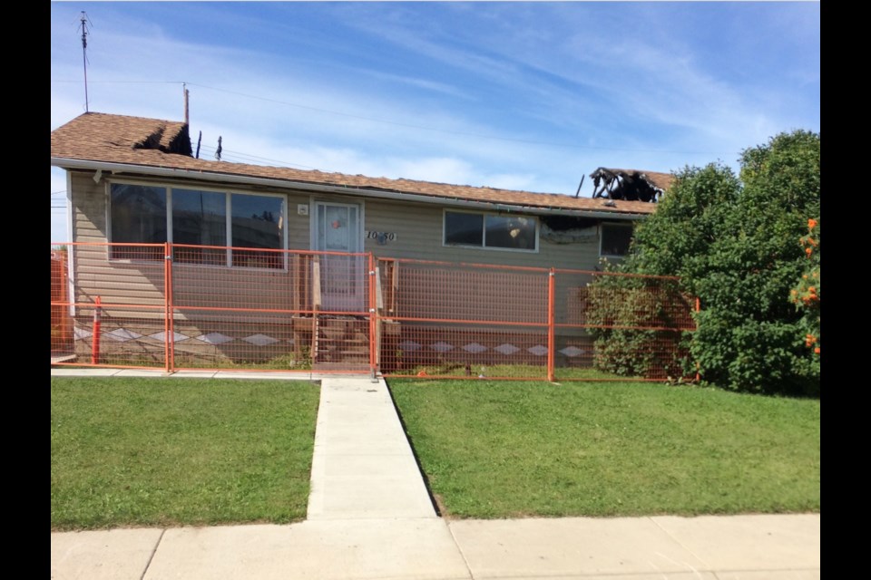 A section of this 105 Street home's roof was destroyed in an August 24 fire.