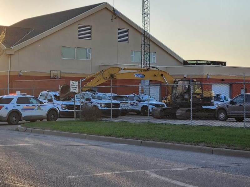 A man operating an excavator smashed his way through the Bonnyville RCMP detachment compound this evening. 
LakelandTODAY.ca photo