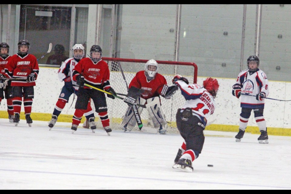 Clippers forward Denzel Whitford-Bull fires one at the Dewberry net in Saturday night's U-11 game at the Bold Center.