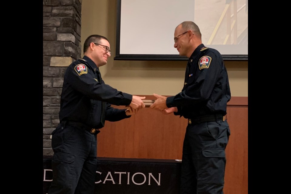 Firefighter Dave Moseley receives this year's Firefighter Peer Recognition Award.