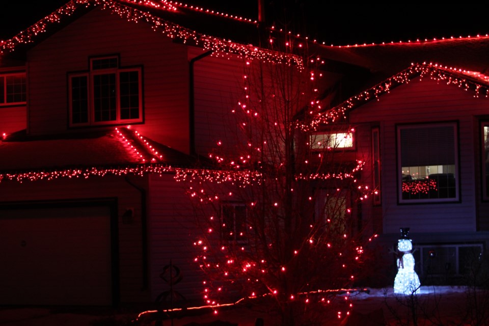 A red glow in the hamlet of Beaver Lake.   A local contest is underway by the Light Up The Night LLBC committee.    Image Rob McKinley