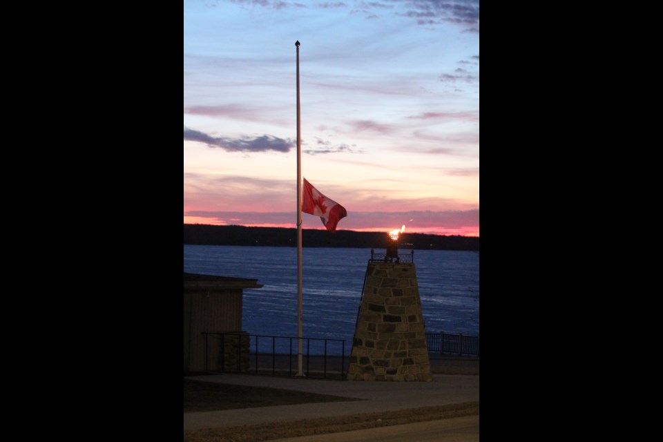 The Canadian flag has been lowered at the Lac La Biche Canadian Legion McGrane Branch 26 beside the community cenotaph and the Eternal Flame.            Images : Rob McKinley / LLB POST