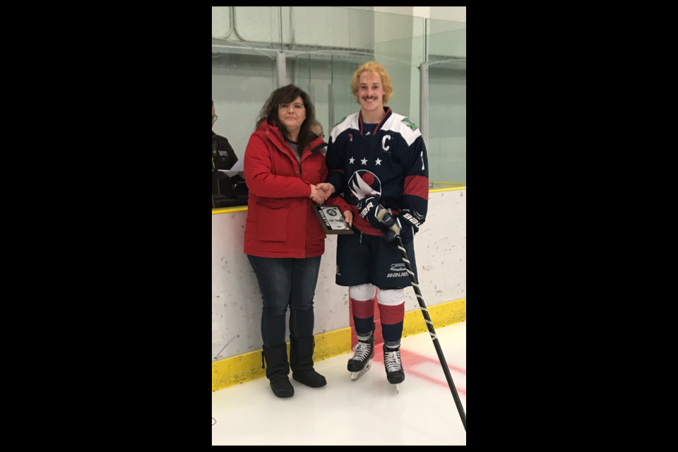 Isaac Barr won MVP, and Best Forward. Lisa Davies handed out the awards.