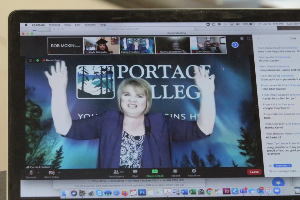 Portage College's Vice-President of Planning Carrie Froehler shows the virtual viewers the hand-wave that replaces normal applause during Friday's virtual convocation ceremony.