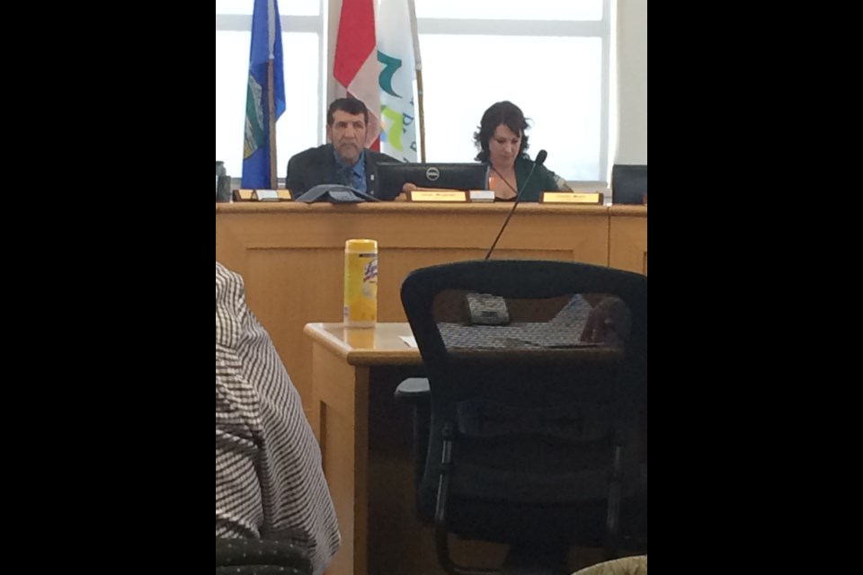 A disinfectant bottle sits on the delegation table awaiting county staff to update Lac La Biche County Mayor Omer Mogrhabi, Deputy Mayor Charlyn Moore and the rest of council at Tuesday's special COVID council meeting. 