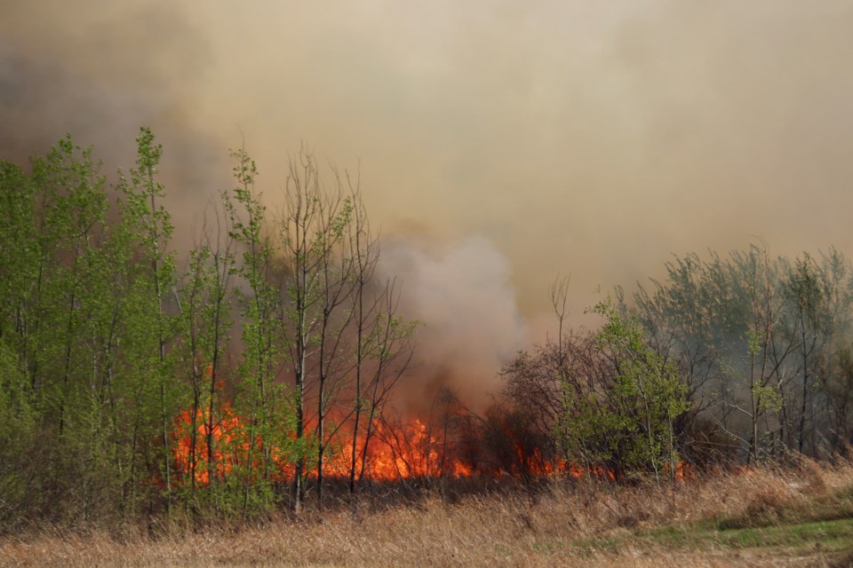 The fire spread quickly due to dry and windy conditions. 