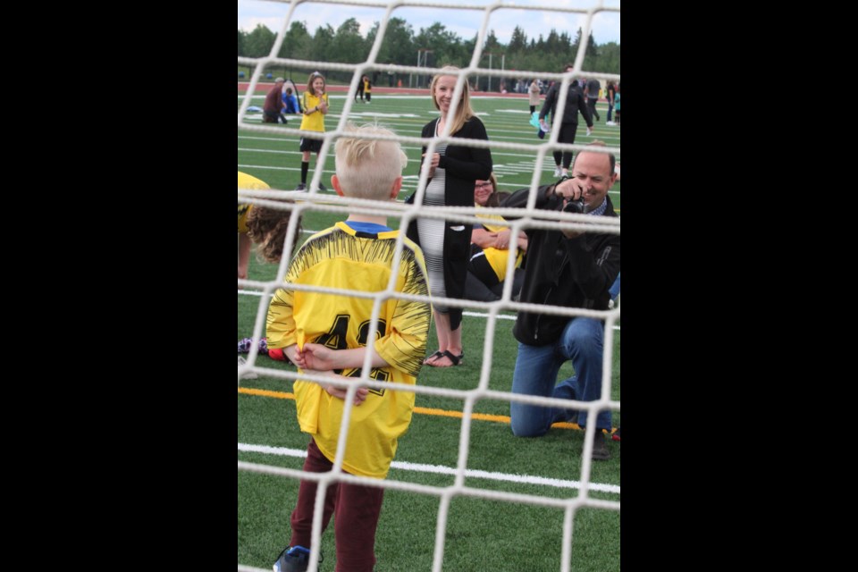 Soccer dad Lee Goselin volutes as a team photographer for last week’s season wrap-up event for Lac la Biche minor soccer at the Bold Center Sports Fields