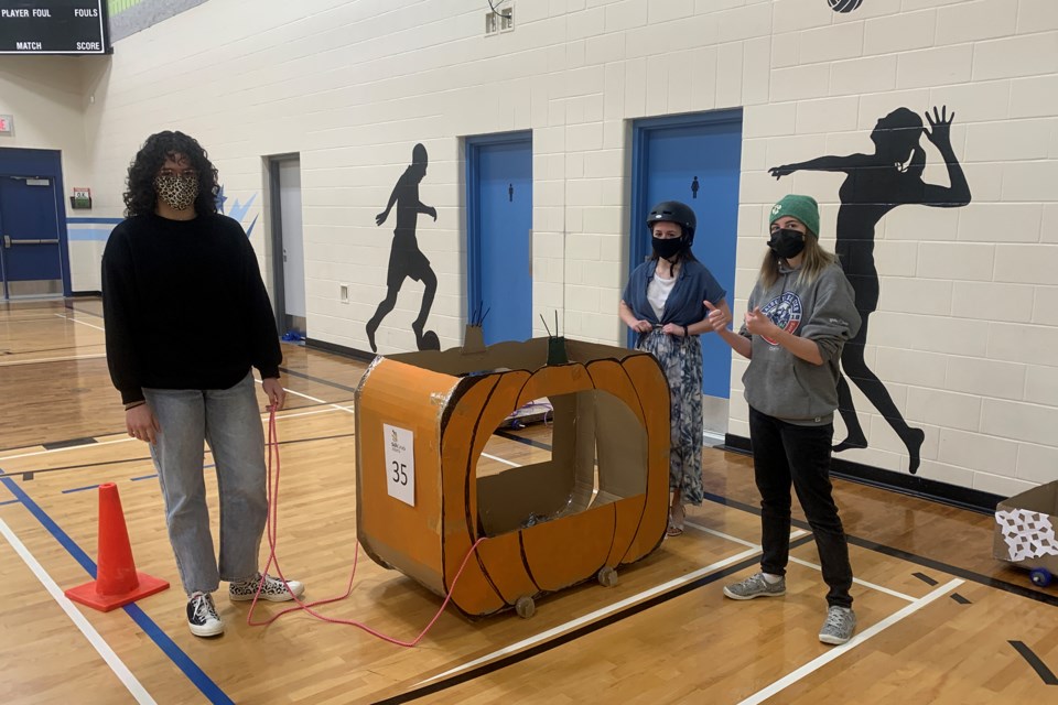 Students get ready to race in their cardboard chariot. Photo supplied.