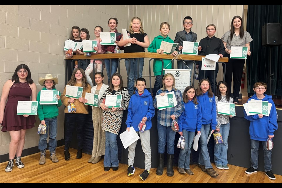 Junior 4-H members are pictured after giving their speeches and presentations on Feb. 26 at Portage College.