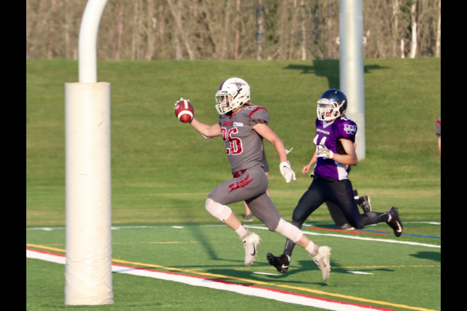 Jets defenceman, Philip Mudge, sprints through the end zone for a touchdown during the second quarter. 