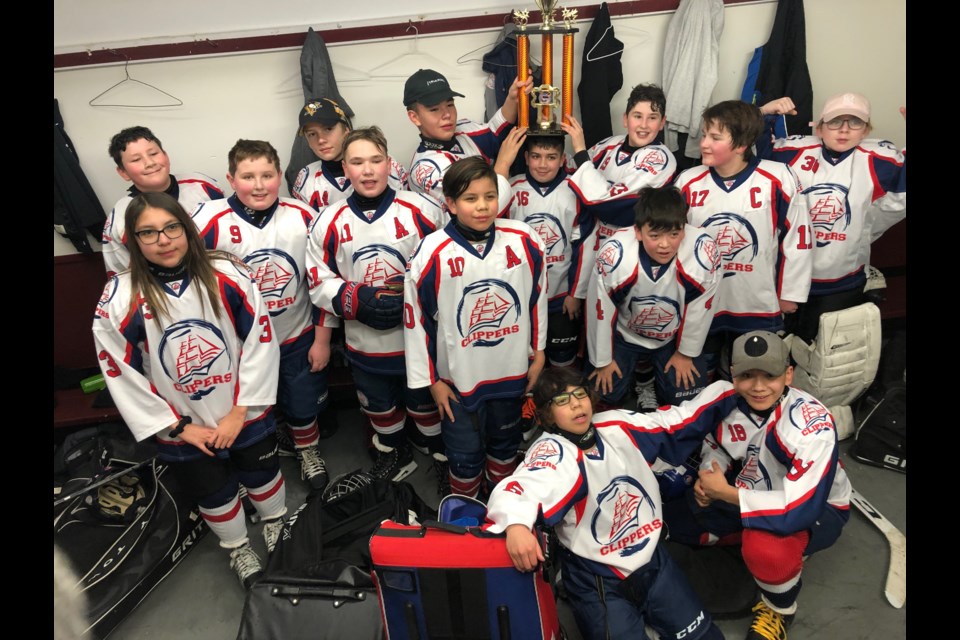 The Lac La Biche peewee team with their third place trophy says thanks to St. Paul for hosting them.