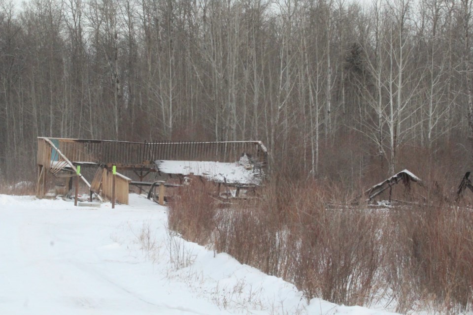 Lac La Biche County Peace Officer Warren Young said he looked down this long driveway to see a man near the burning house.