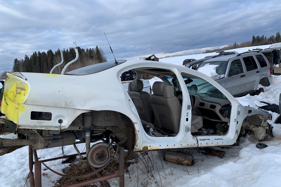 RCMP have charged two men after dismantling a suspected chop shop in the La Corey area.