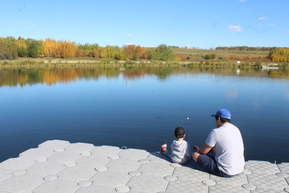 Jay Ignacio and his two year-old son John-Cedrick we’re enjoying some fishing and fall colours at Lac La Biche’s Alexander Hamilton Park Tuesday afternoon.      Image Rob McKinley