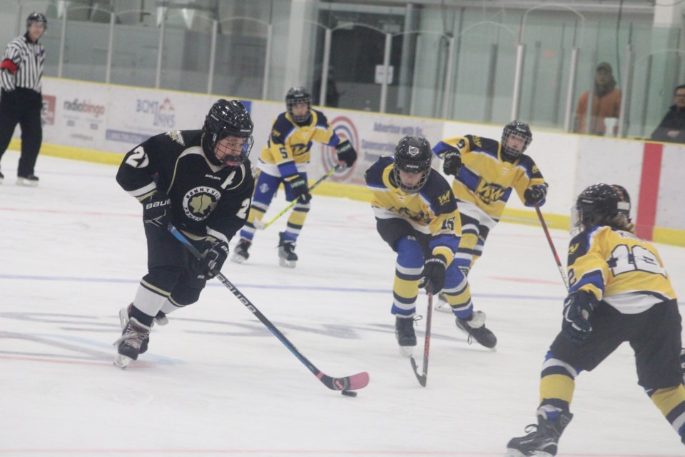 Bonnyville Pontiacs forward Avery Mitchell carries the puck on a rush up the ice  in Friday night's game at the Bold Center against Edmonton's West Whitemud team. The game was part of an 18-team tournament hosted by the Beaumont U13 team to remember two brothers from Spruce Grove tragically killed in 2016. / Chris McGarry Photo