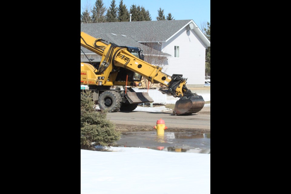 Crews worked with heavy equipment as well as hand tools to clear culverts and ditches.
