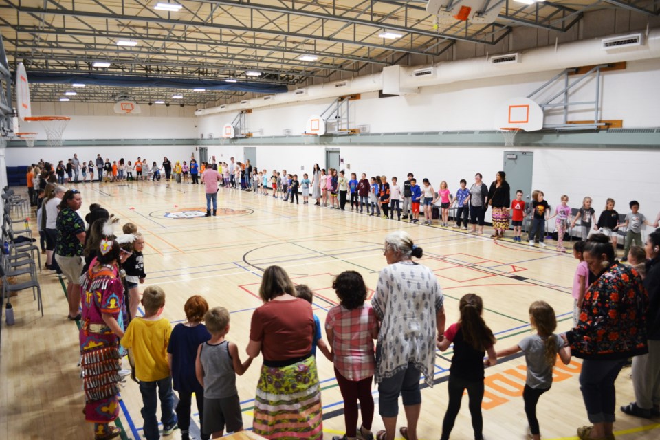 Parents, families and special guests joined Elk Point Elementary School students and staff for a massive Round Dance to the beat of Efrem Saddleback’s traditional moosehide drum to wrap up the school’s National Indigenous People’s Day celebration.