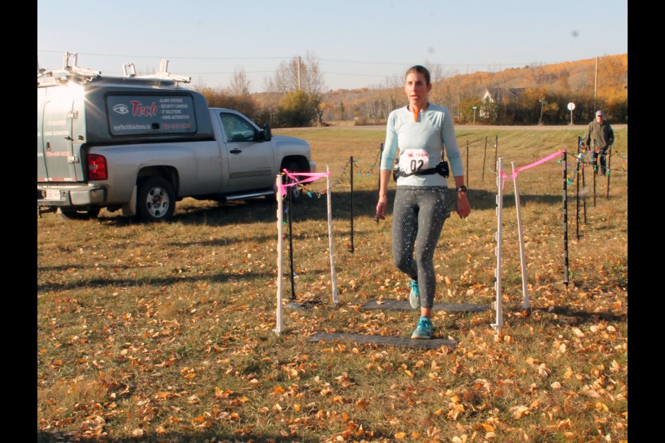 Relay team member Janna Zarowny maintained the Hawks team’s lead as she charged over the timer blocks at the Lindbergh staging area after her two and a half hour run on the scenic but challenging ups and downs of the course from the Forts checkpoint.