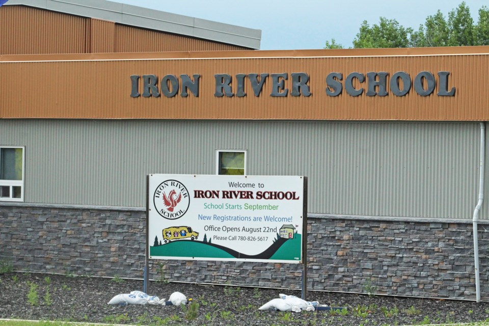 A sign outside the Iron River School last Tuesday afternoon welcomes students back to school in September. The sign, and its wording, were in place long before Tuesday’s back-to-school announcement by the provincial government.     Image: Rob McKinley