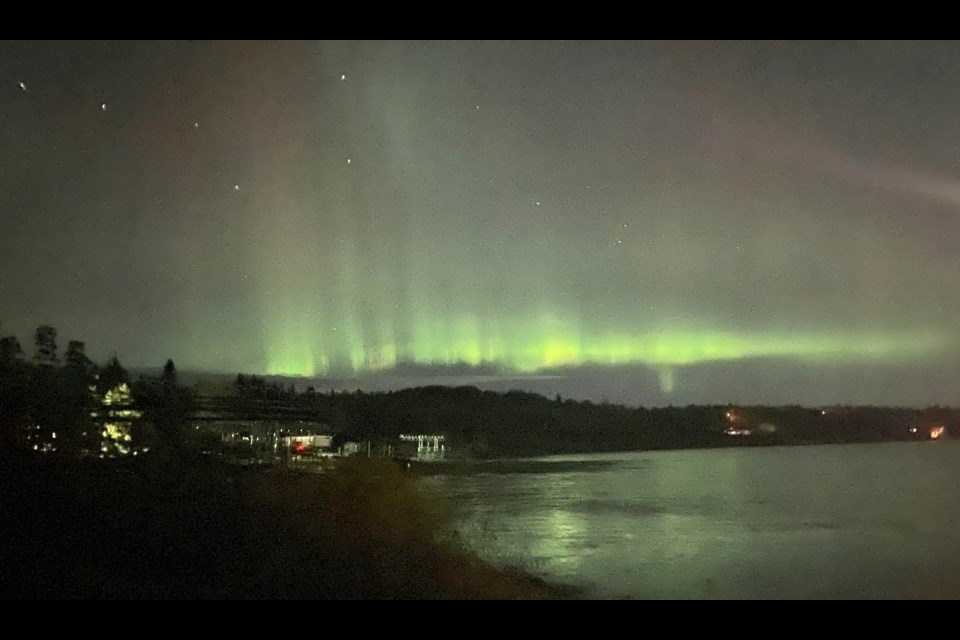 Tuesday night's northern lights display highlights the Big Dipper constellation in the sky over Beaver Lake in Lac La Biche County