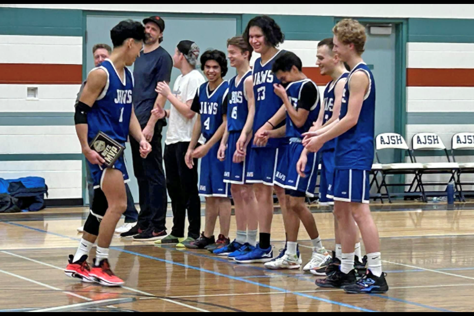 The J. A. Williams High School Sharks boys share a laugh after winning their final game to earn the Crusaders Cup for the second year running.