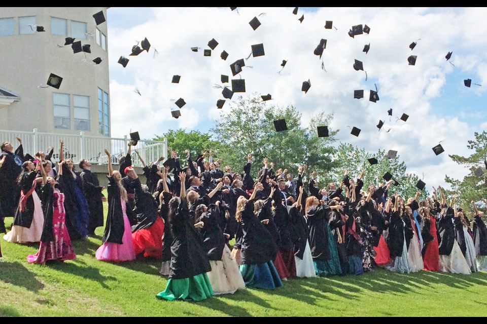 The J.A. Williams High School grad caps were flying for the outdoor class photo held in Lac La Biche’s McArthur Park Friday afternoon.  More here: https://www.instagram.com/laclabichepost/
     Image: Rob McKinley