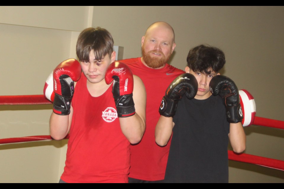 LLB Boxing Club co-coach Jeremy Trimble with boxers Cam Laviolette and Zander Lavalee.