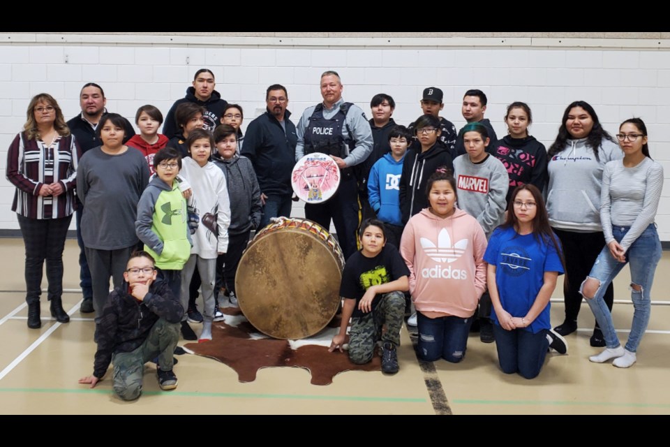 Lac La Biche RCMP Const. Joe Greer with students and community mebers of Beaver Lake Cree Nation.