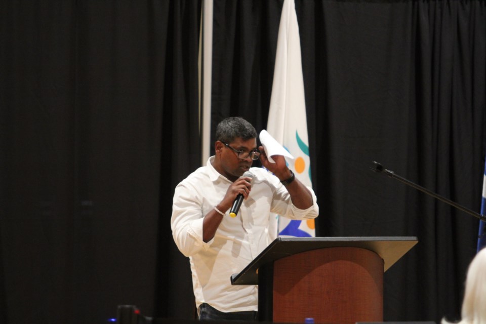 Ward 7 candidate John Mondal prepares for his opening remarks.