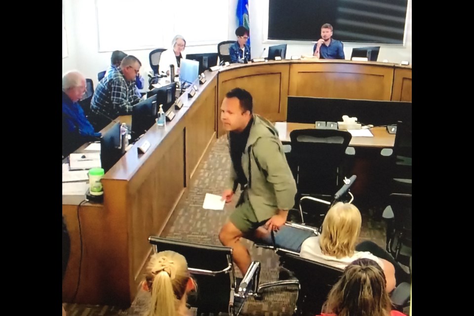 Property owner Jordan Gauthier leaves the Lac La Biche County council delegation table after presenting his strong opposition to the re-zoning of property near his own for a homeless transitional facility.