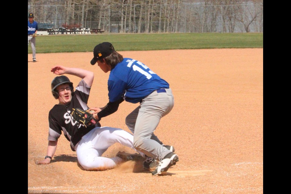 Lac La Biche U15 Dodgers pitcher Josh Berland covers the plate and gets the out on an attempted steal by an Elk Point White Sox player in Saturday's local baseball tilt.