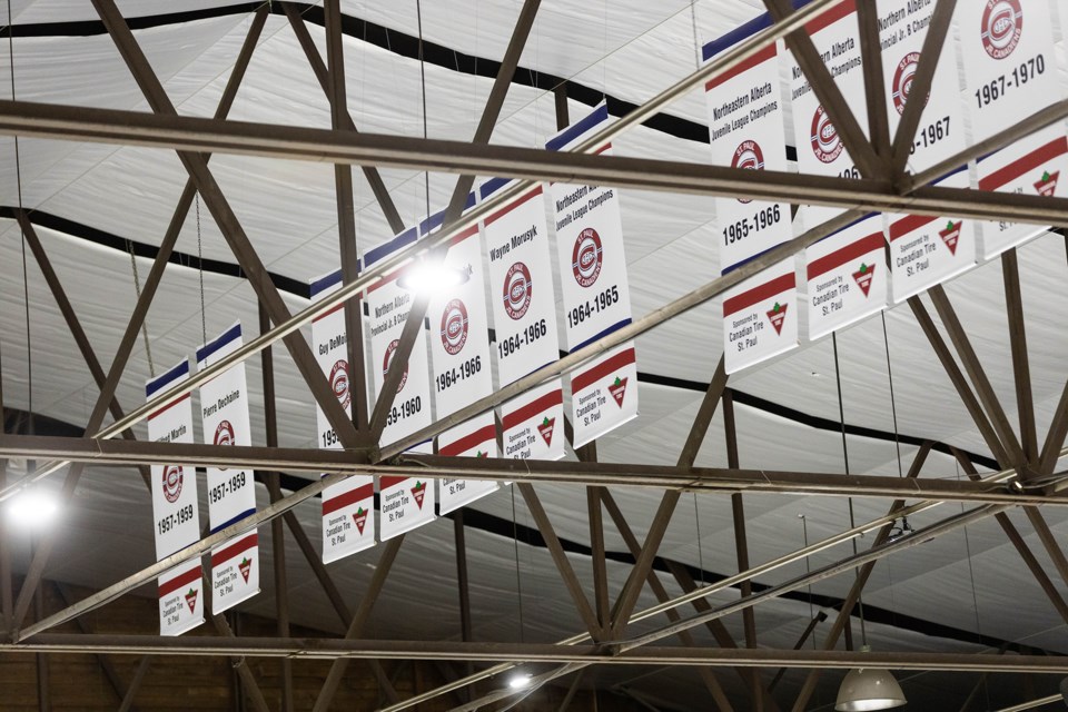 New banners hang in the rafters of the Clancy Richard Arena, listing championship teams, players and builders of the organization. 