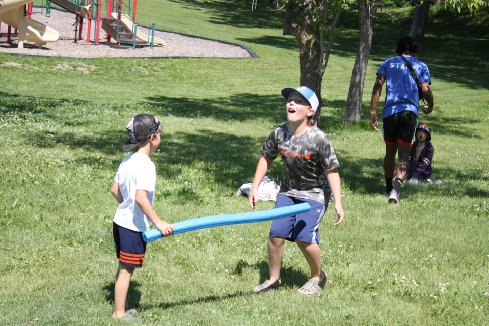 A twist on the classic game of tag; instead of simply tagging their opponents with their hands, these kids used pool noodles to put them out of the game. Jude Miller tags Leaf Flumian during a contest that took place at Dumasfield Park on Tuesday. 